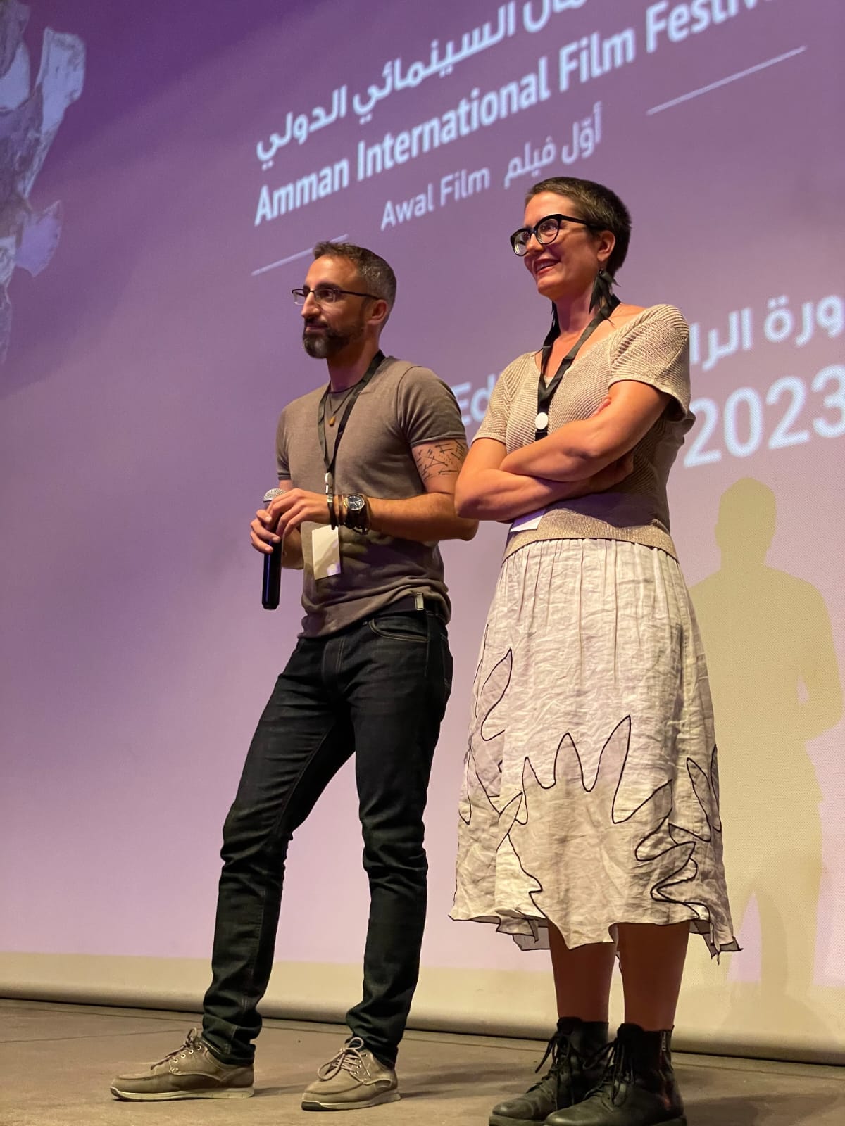 Filmmakers Rami Younis and Sarah Ema Friedland stand side-by-side at a Q&A session for "Lyd."