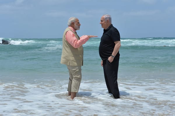 Modi & Netanyahu in the ocean with water up to their ankles